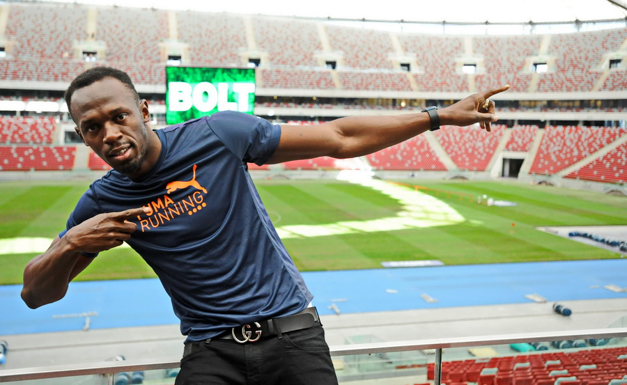 Warszawa, 20.08.2014. Jamajski sprinter Usain Bolt pozuje do zdjęcia na Stadionie Narodowym w Warszawie, 20 bm. Mistrz olimpijski i mistrz świata będzie największą gwiazdą lekkoatletycznego Memoriału Kamili Skolimowskiej, który odbędzie się 23 bm. na Stadionie Narodowym w Warszawie. (gj) PAP/ Bartłomiej Zborowski