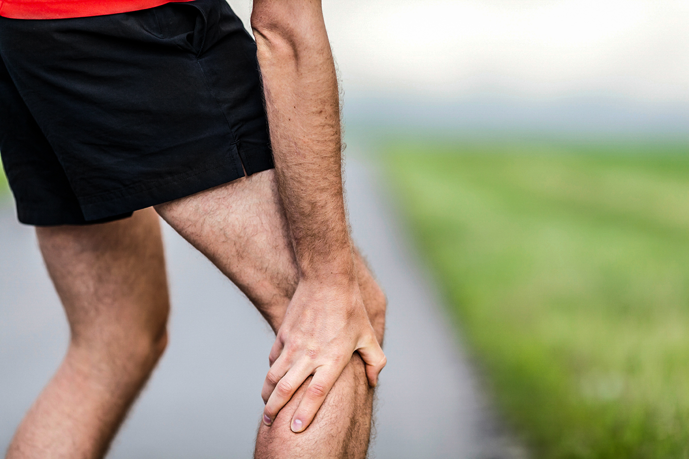 Runner leg and muscle pain during running training outdoors