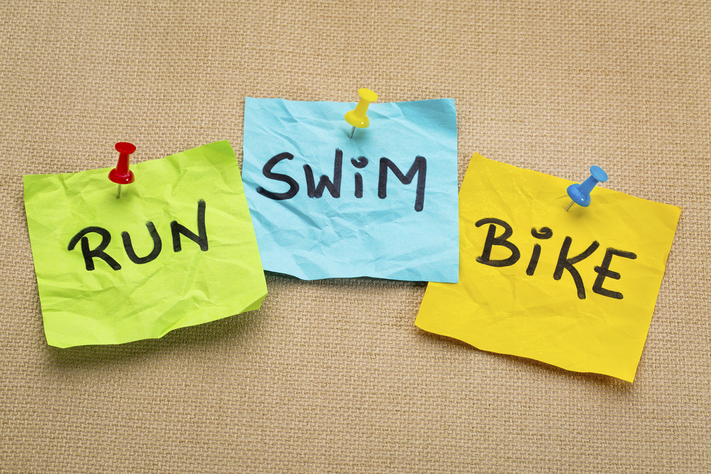 run, bike, swim - triathlon concept