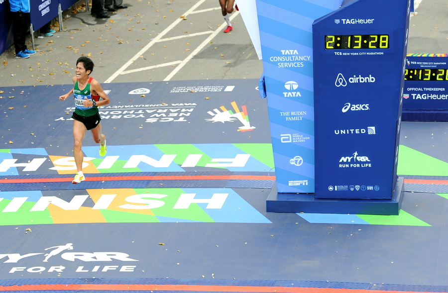 NEW YORK, NY - NOVEMBER 01:  Yuki Kawauchi of Japan crosses the finish line at TAG Heuer Official Timekeeper and Timepiece of 2015 TCS New York City Marathon on November 1, 2015 in New York City.  (Photo by Craig Barritt/Getty Images for TAG Heuer)