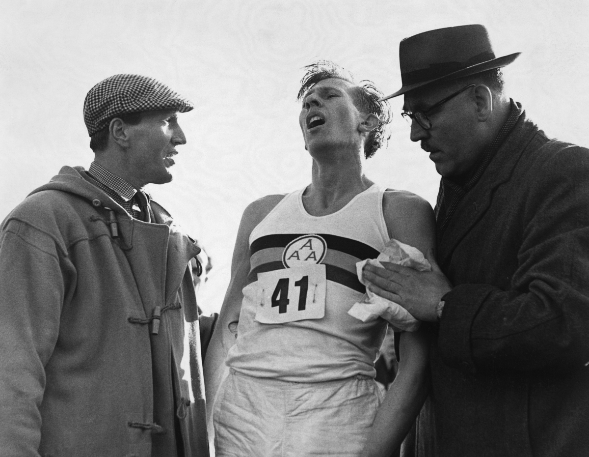 Roger Bannister just after his world record beating run at Oxford when he ran a mile in less than four minutes. His time tonight was 3 min 59.4 sec. | Location: Iffley Road, Oxford, England, UK. (Photo by © Hulton-Deutsch Collection/CORBIS/Corbis via Getty Images)