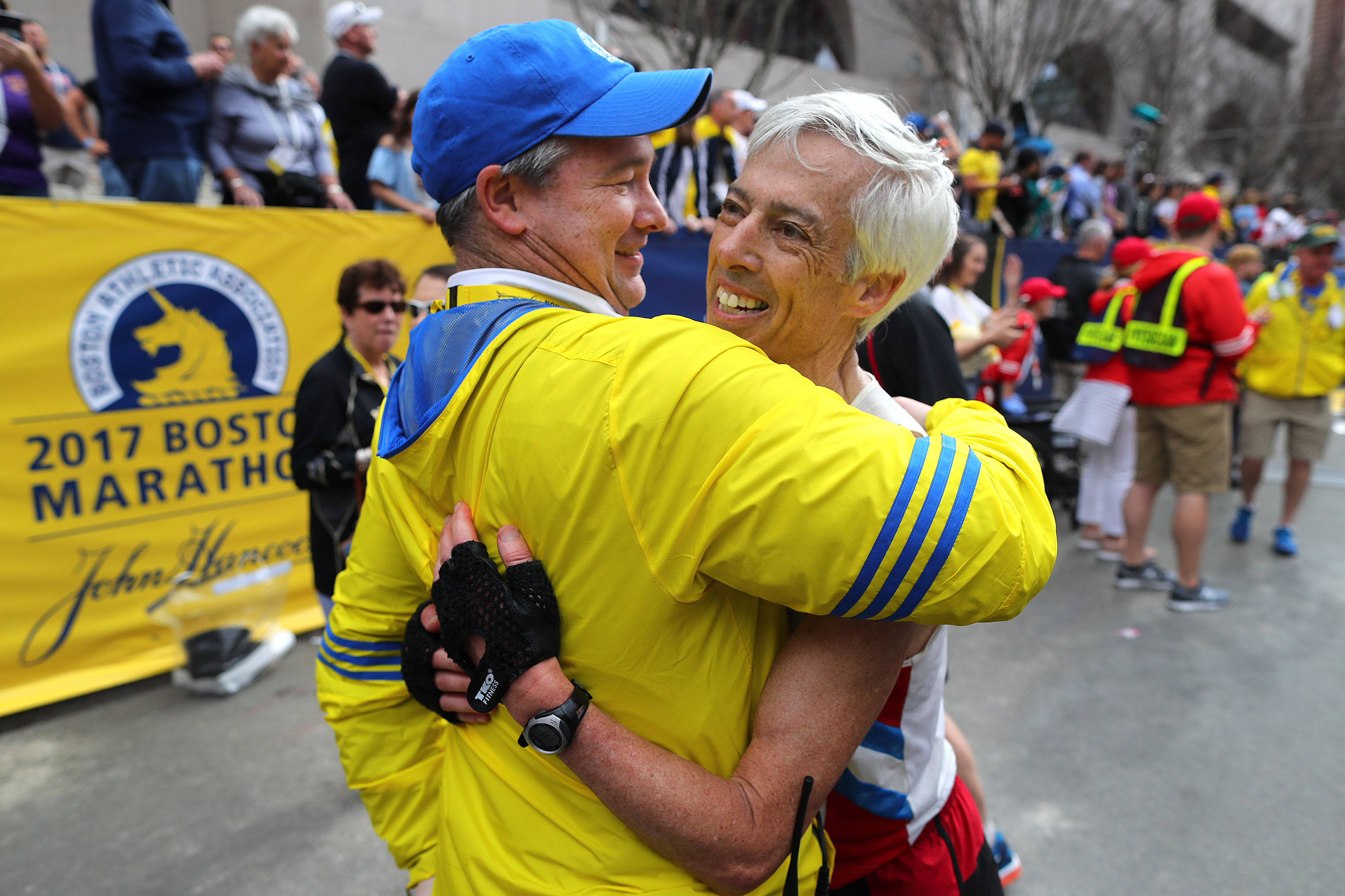 BOSTON, MA - APRIL 17: Bennett (Ben) Beach, right, is hugged by Boston Athletic Association's Jack Fleming after Beach finished in his 50th straight Boston Marathon at the 121st Boston Marathon finish line on April 17, 2017. (Photo by John Tlumacki/The Boston Globe via Getty Images)