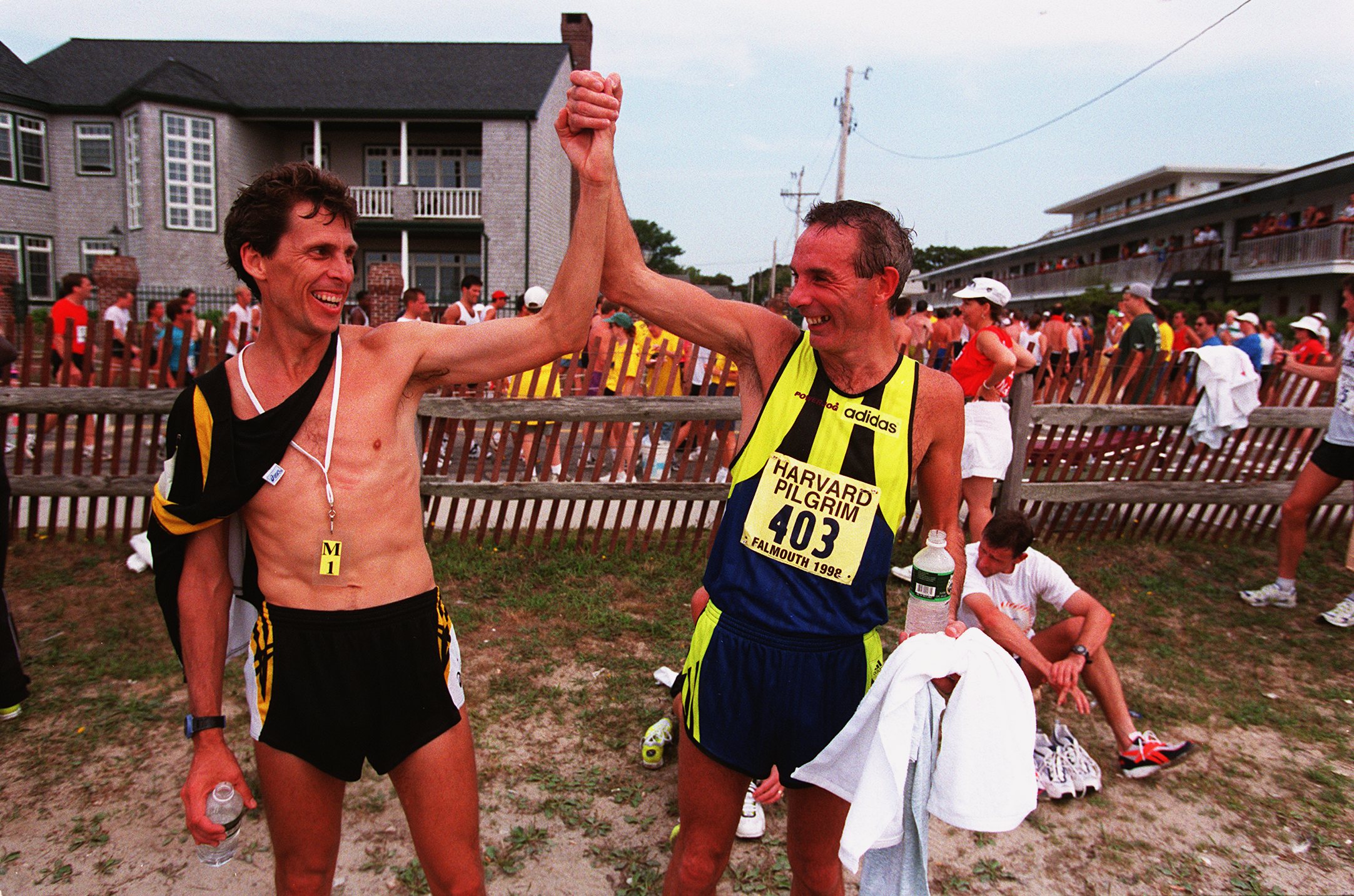 FALMOUTH - AUGUST 16: Master runners Steve Plasencia, left, and Keith Anderson, right, came in together to finish the Falmouth Road Race. (Photo by Evan Richman/The Boston Globe via Getty Images)
