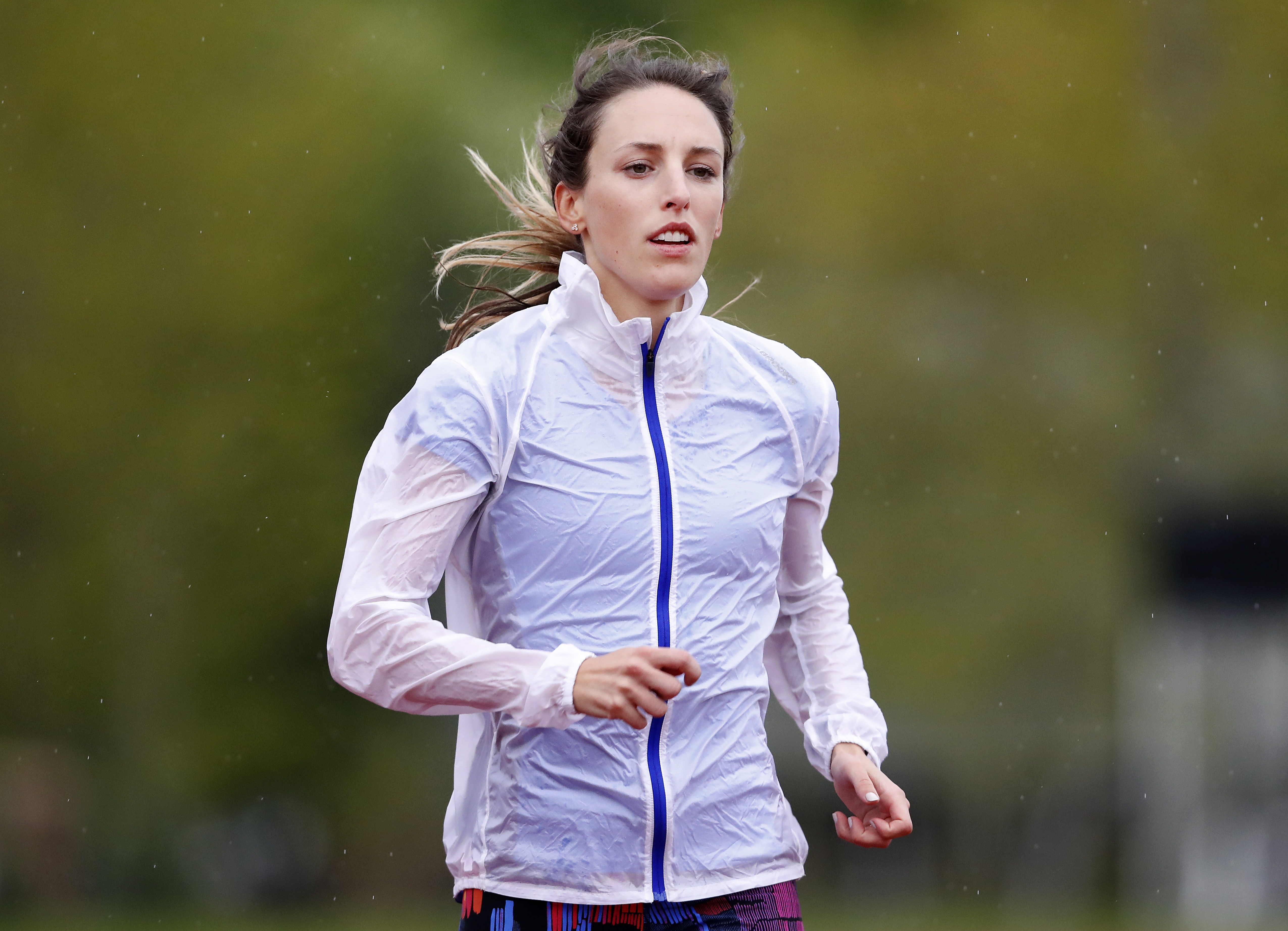 Gabriele "Gabe"Grunewald trains at Macalester College in St. Paul, Minn, May 8, 2017. The Minnesota championship runner who has inspired many during her long, public fight against cancer is in grave condition. Grunewald's husband says she was moved to comfort care at a Minneapolis hospital Sunday, June 9, 2019. (Carlos Gonzalez/Star Tribune via AP)