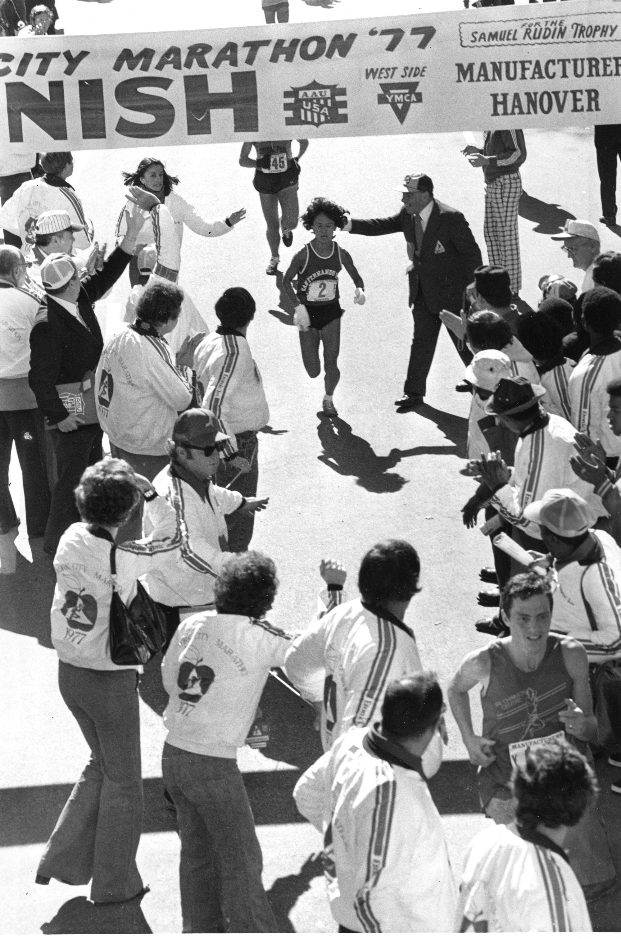 Miki Gorman (2) approaches the finish line in Central Park as the first woman finisher in the New York City Marathon, Sunday, Oct. 23 1977. The 42-year-old Japanese-American from San Francisco, Ca., won the 26-mile, 335-yard race for the second straight year. (AP Photo)